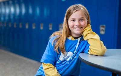 Photo of child wearing an RCU tishirt