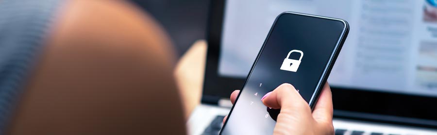 Woman looking at her phone with a lock on it