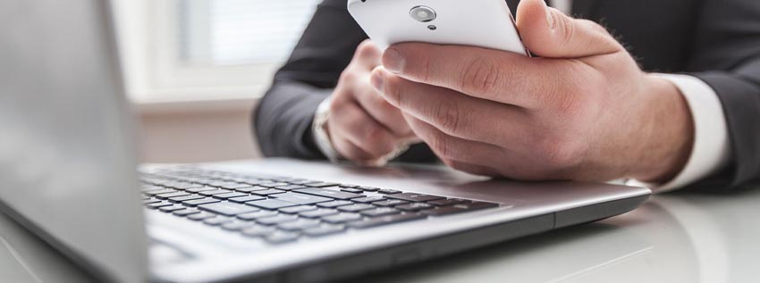 Business person using his phone for banking