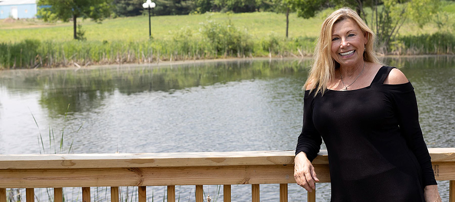 Business woman standing in front of railing