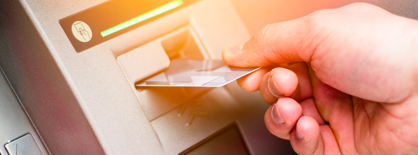 Person using ATM machine