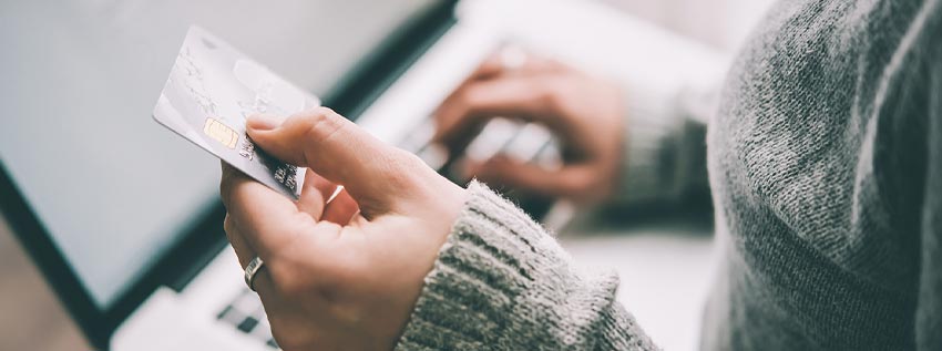 Woman holding a credit card