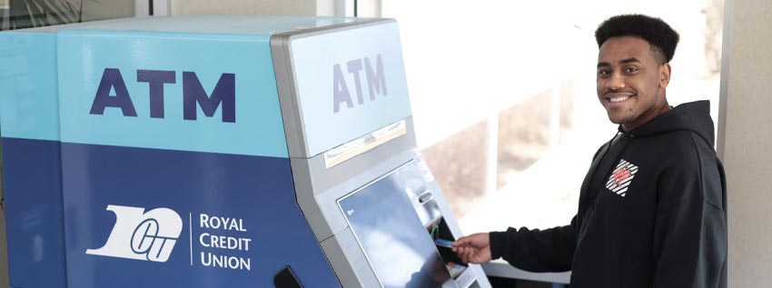 Man standing in front of an ATM