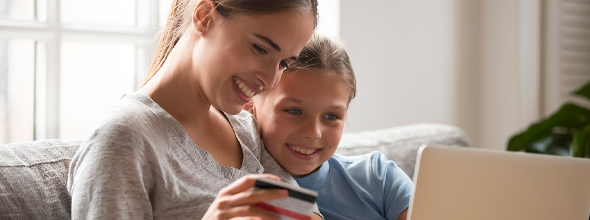 Mother and daughter looking at a computer