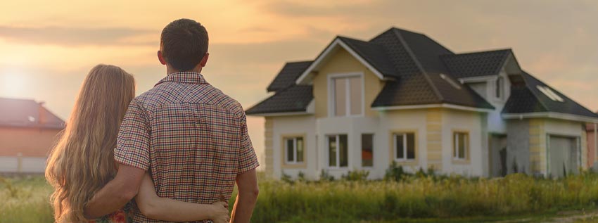 Young couple looking at their new house