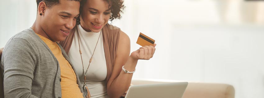 Couple working to setup direct deposit