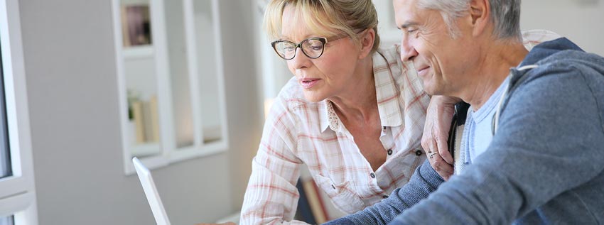 Two people looking at their computer screen