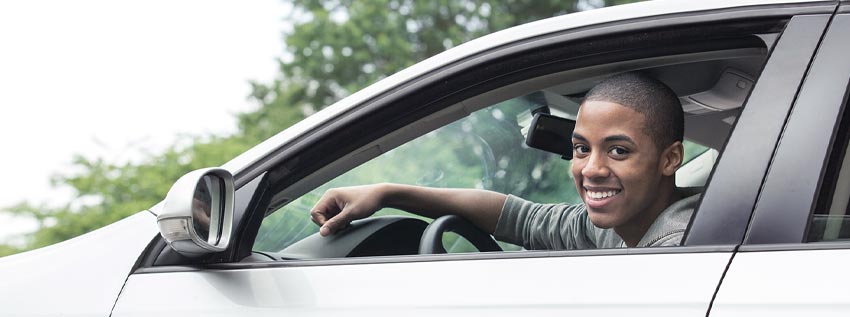 Man sitting in his new car