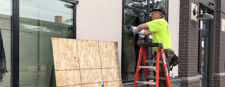 Man installing new windows at a business