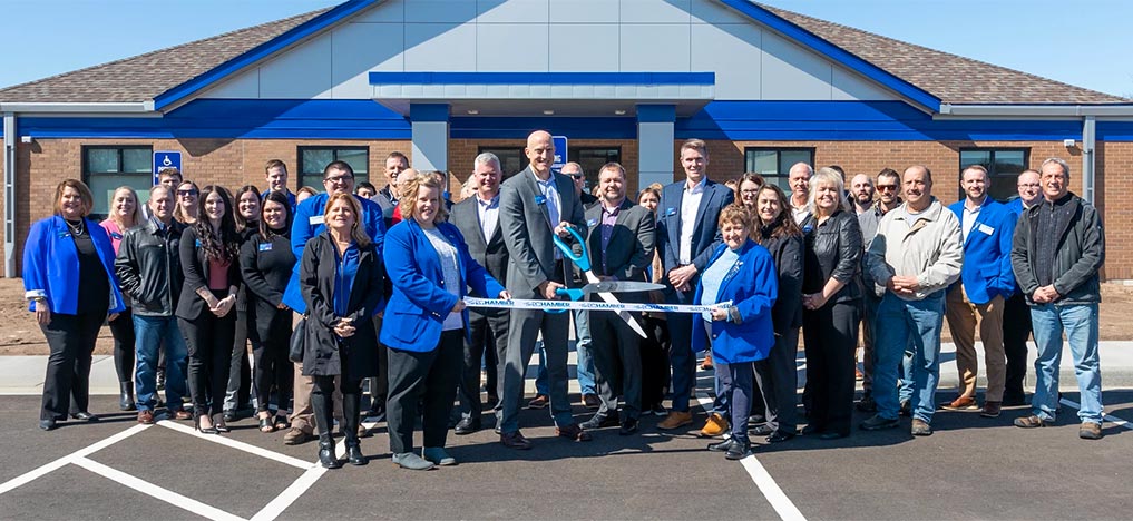 Photo of folks at the ribbon cutting at the new center