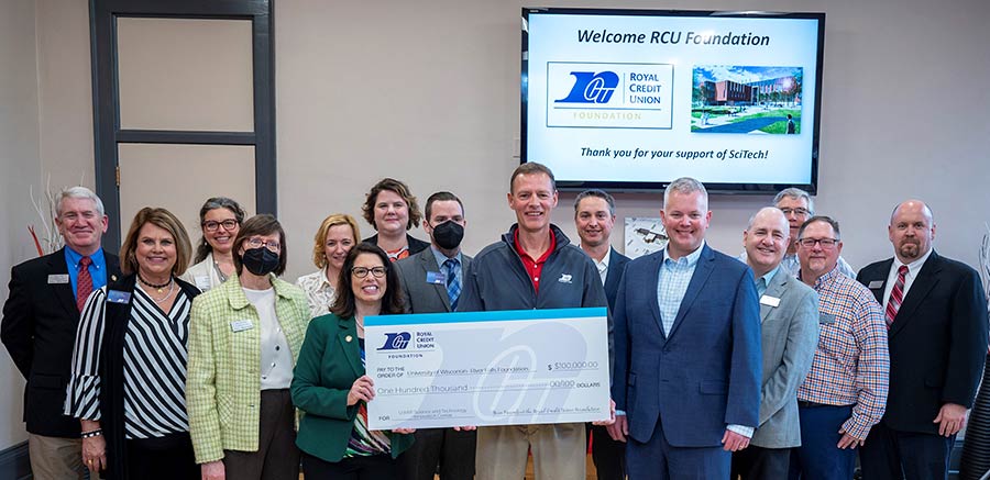 Group of people holding a big check at UWRF