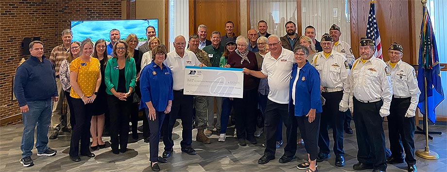 Group of RCU team members and VFW folks holding a check