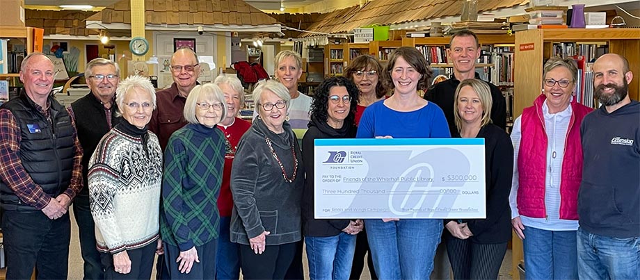 People holding large check for Whitehall Library