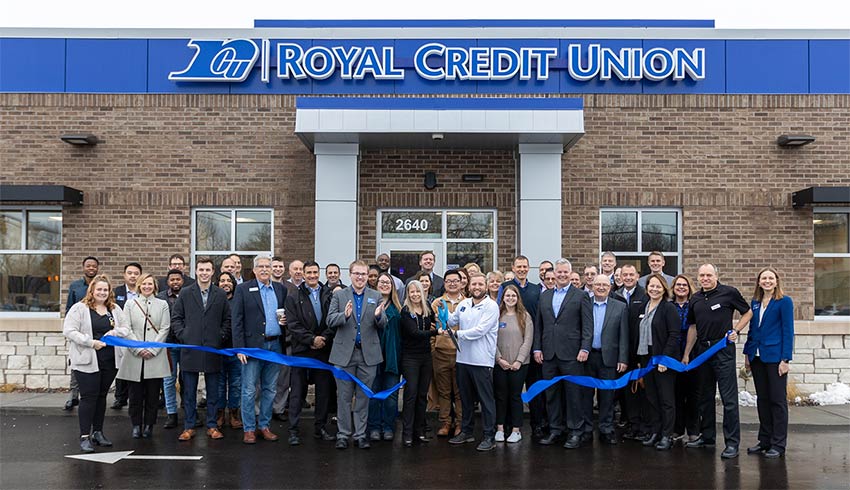 Photo of folks at the ribbon cutting at the new St Paul office