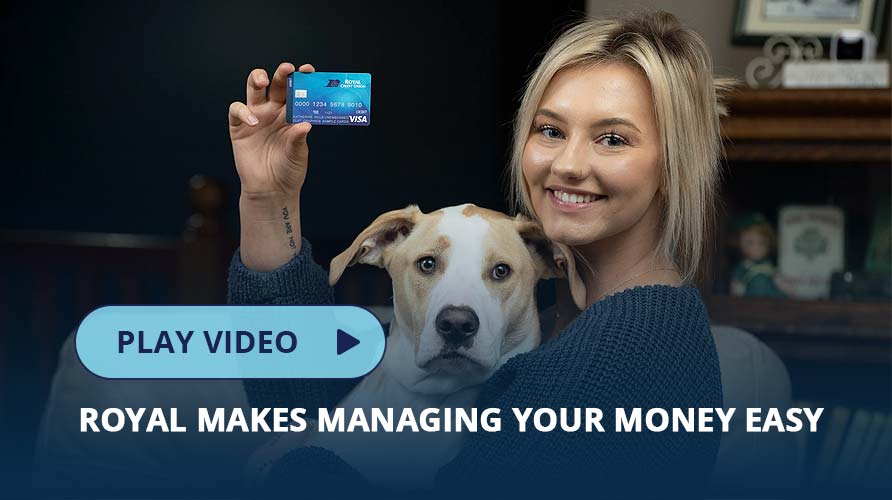 Young adult holding a debit card with her dog