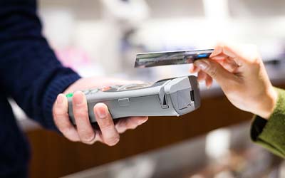 Person using contactless debit card