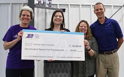 Folks holding a check from the Foundation