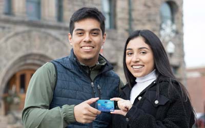 Young couple holding debit card
