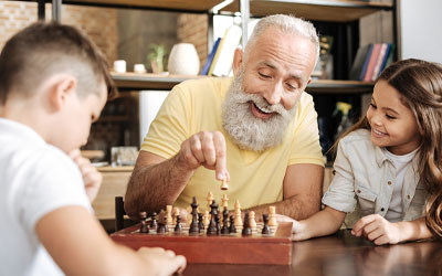 Retired man playing chess