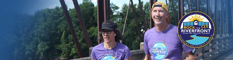Man and wife running at Rock the Riverfront