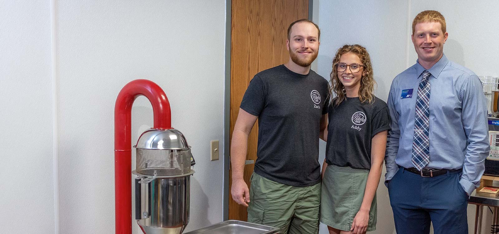man and woman standing inside small business