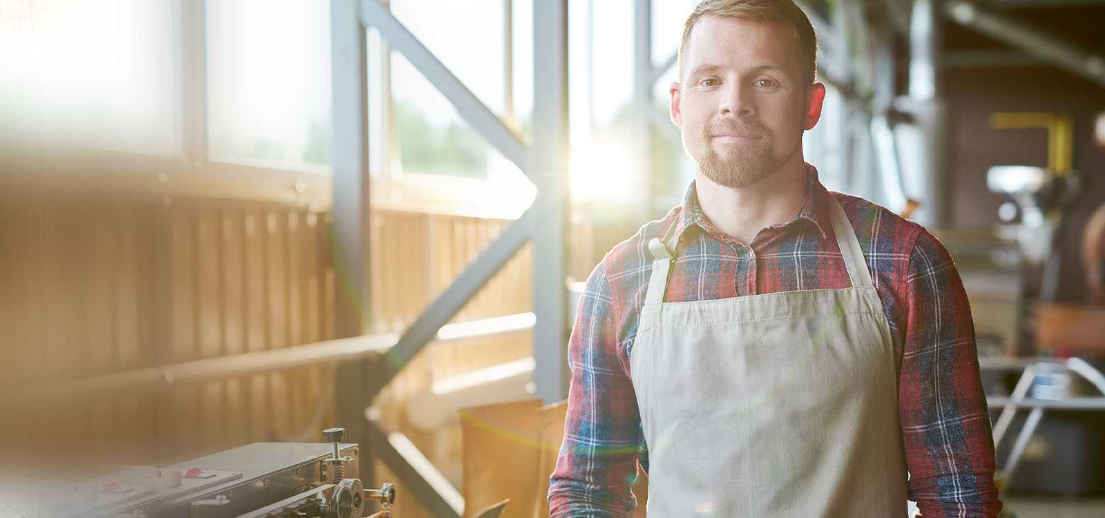 Man standing in his work shop