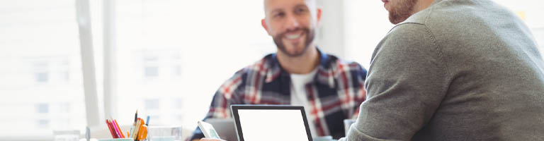 Two men working on computer