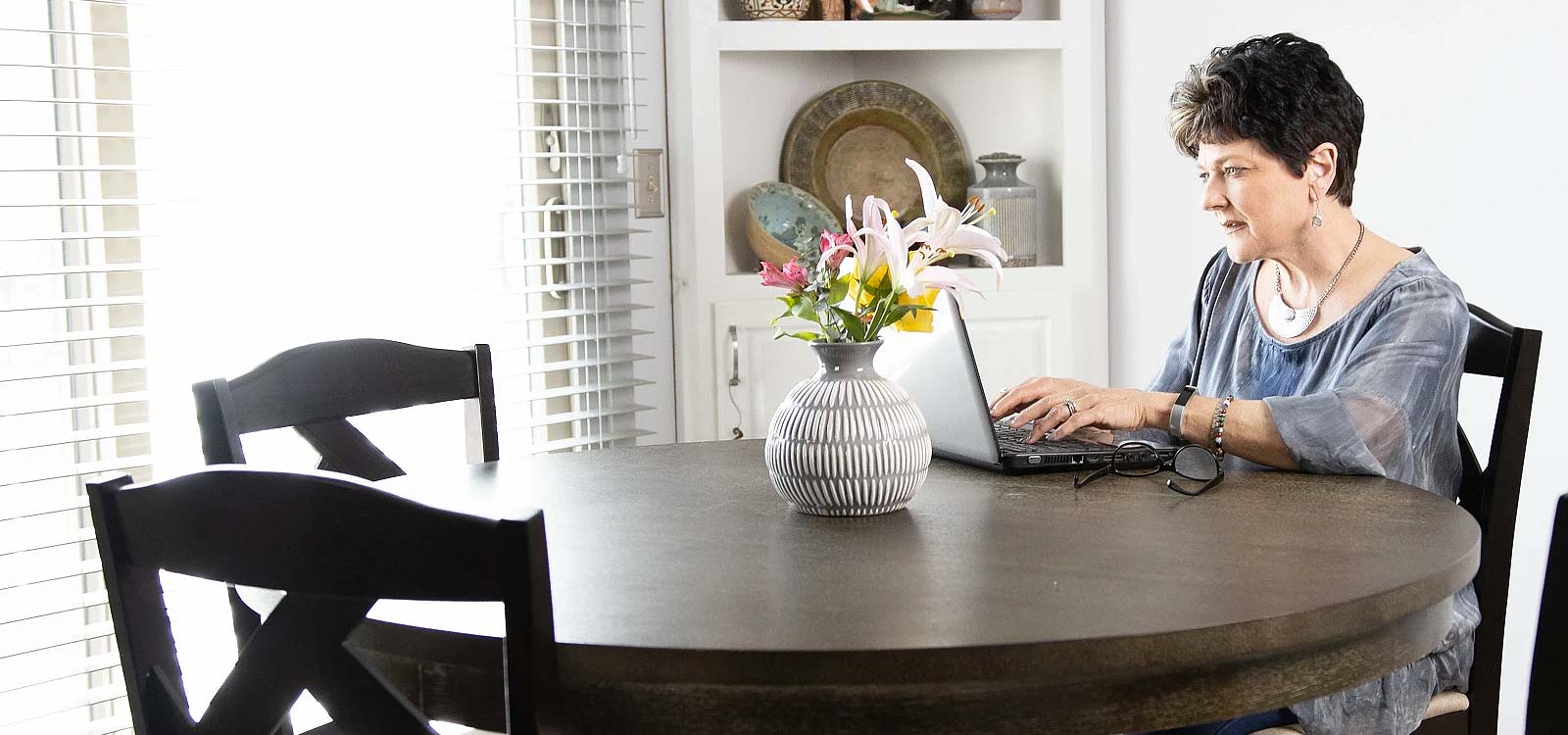 Royal business owner looking at laptop