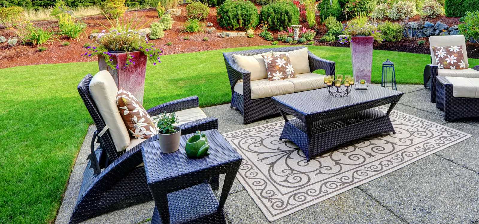outdoor loveseat, chairs, and table on patio