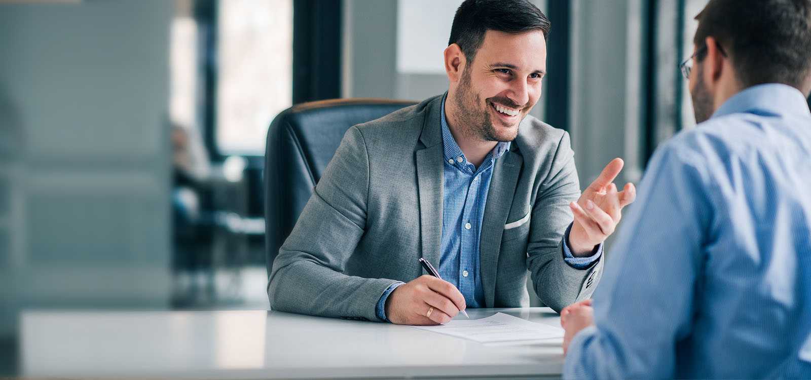men talking in office