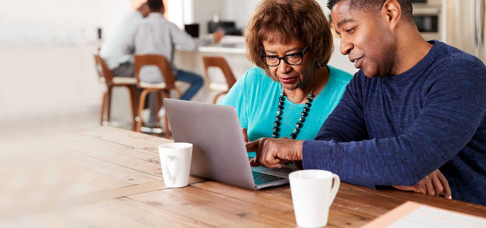 Man helping older woman with security issue