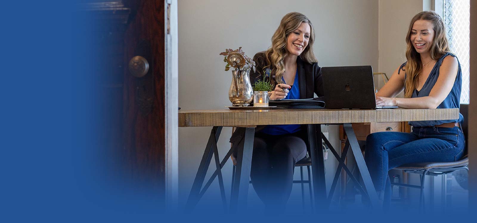 Two women learning about financing