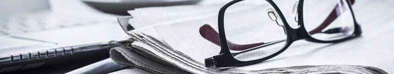 Newspaper and glasses