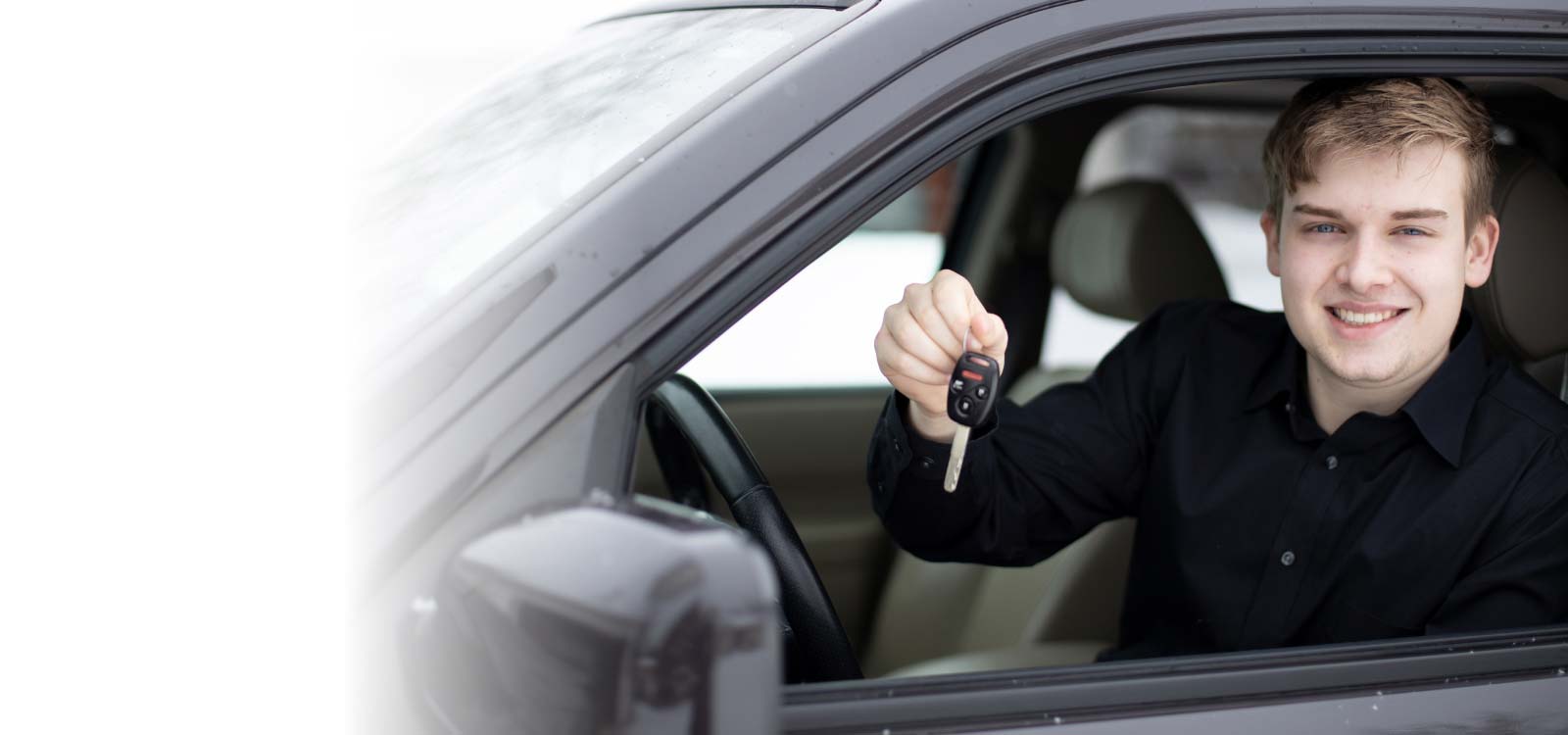 Man holding keys of new car