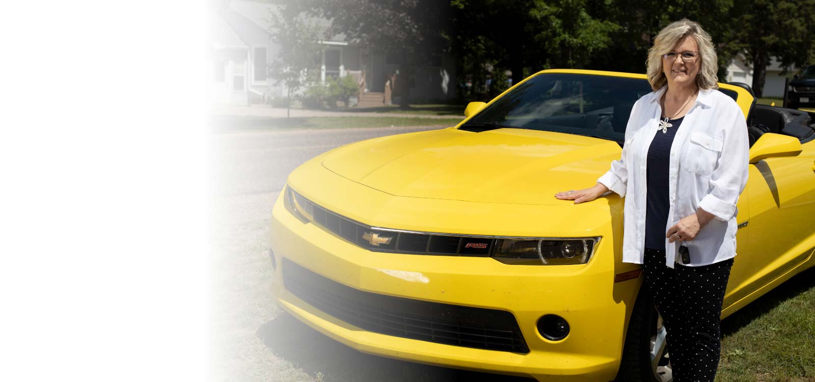 Woman standing in front of new car