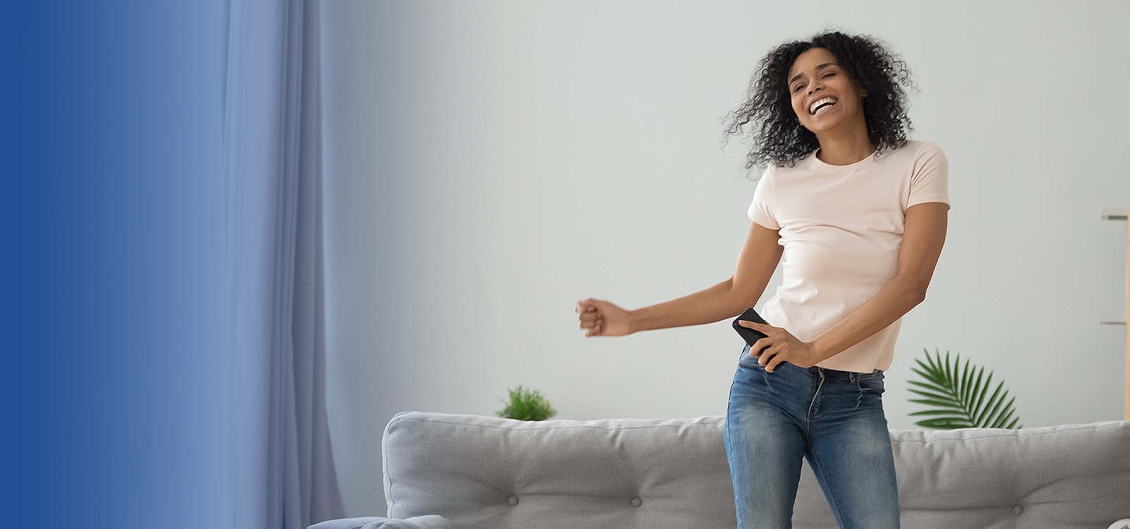 Woman dancing in her living room
