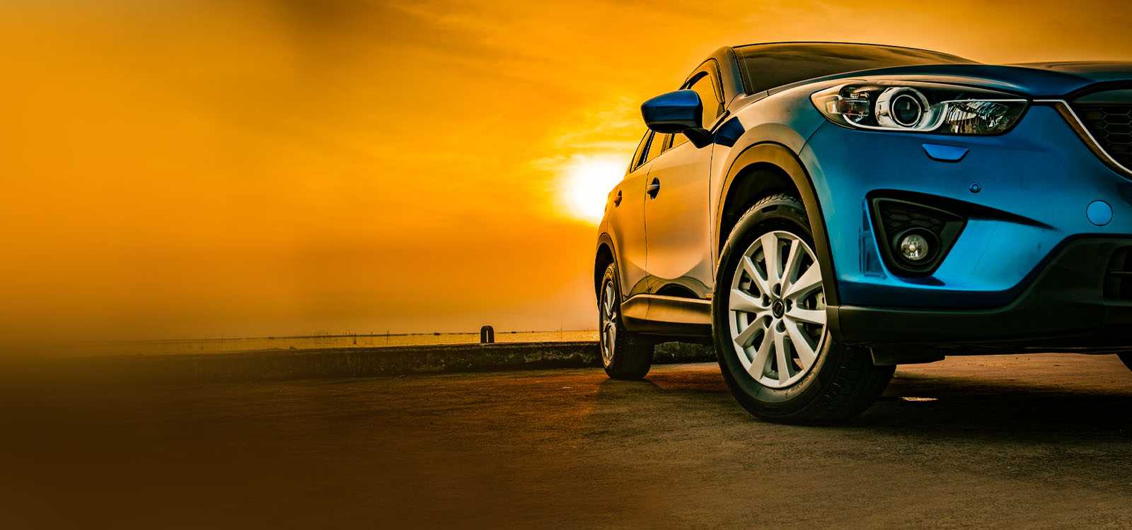 new car at sunset