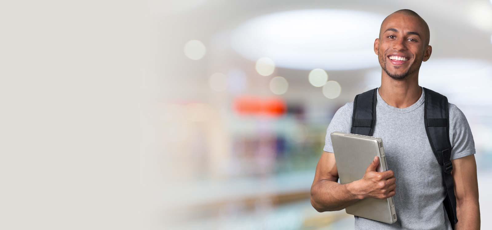 Student holding laptop