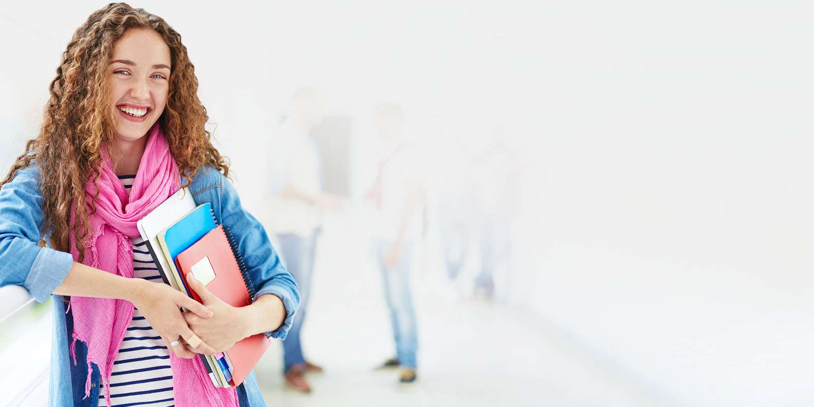 Student leaning against wall
