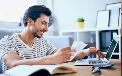 Man setting up bill pay on computer