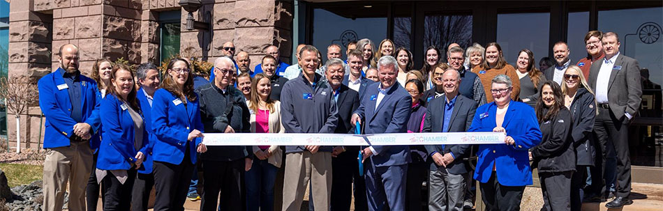 Group of leaders from Eau Claire and RCU cutting ribbon