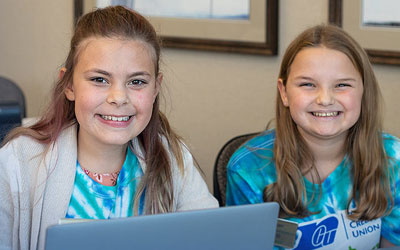 Two students working together on financial education