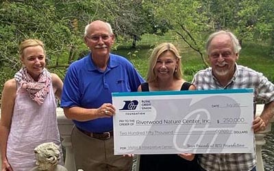 Group of RCU Members holding a big check