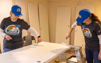 RCU team members painting Habitat houses