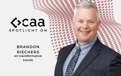 Brandon Riechers with CAA logo