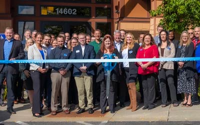 Photo of ribbon cutting at Hugo