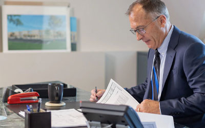 Man using his phone to business bank