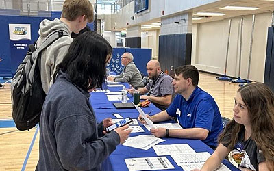 Students working with Test Drive staff