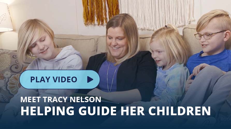 Woman with children sitting on a couch