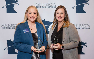 Marketing team members accepting awards
